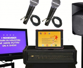 iPad- based karaoke system components, including monitor, iPad, microphones, speaker and mixer.