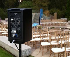 iPlay sound system QSC speaker set up by outdoor stage.