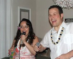 Woman and man sing karaoke.