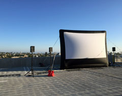inflatable screen setup on rooftop of culver city building.