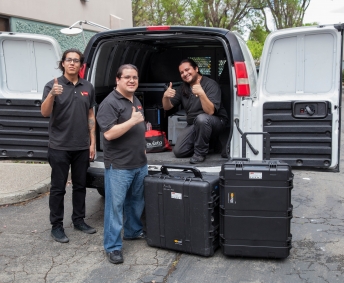 Avista AV team loads equipment into back of van.