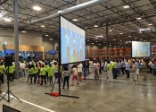 Large projection and screen setup in Silicon Valley warehouse.